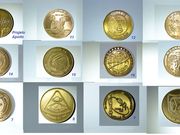 Medalhas comemorativas das missões APOLLO.